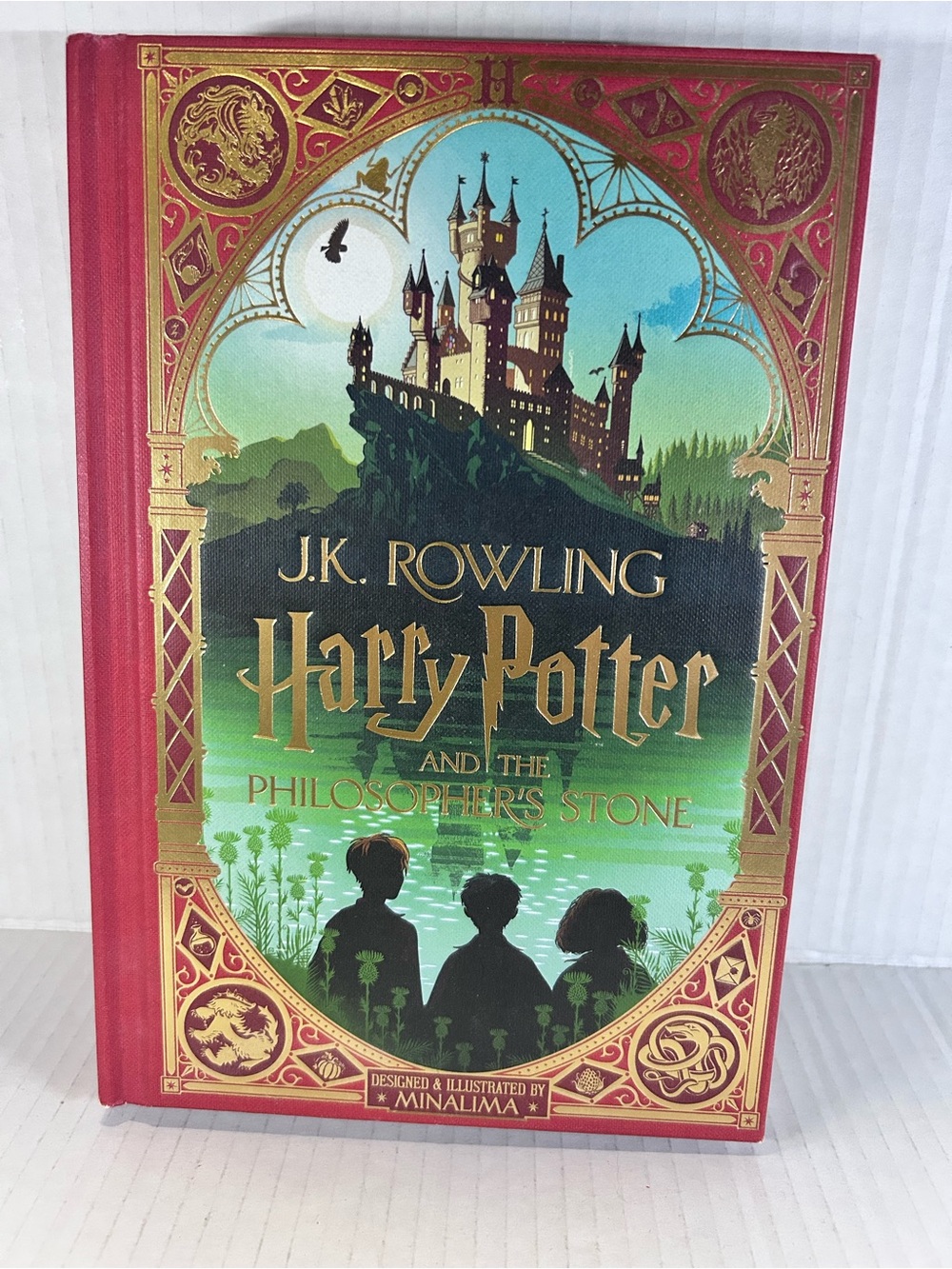 J.K. Rowling Harry Potter and the Philosopher's Stone Hardcover - Red & Green